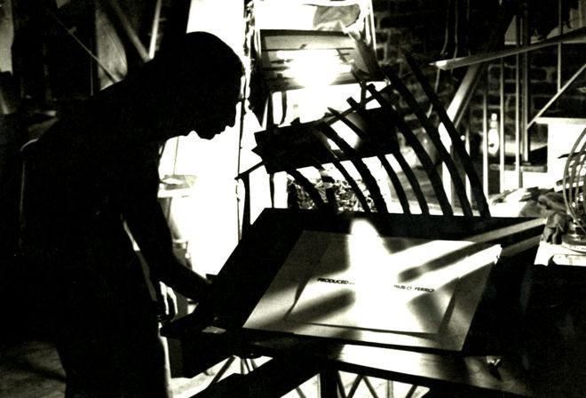 I: Pablo laying out a credit screen at his 2nd Ave. apartment/studio, 1972