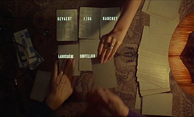 IMAGE: Still - 02 Two hands dealing cards with credits